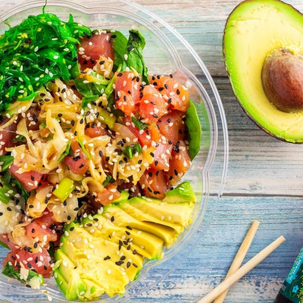 DaKine Hawaiian Kitchen NSB poke bowl with tuna, seaweed salad, avocado, and sesame seeds.