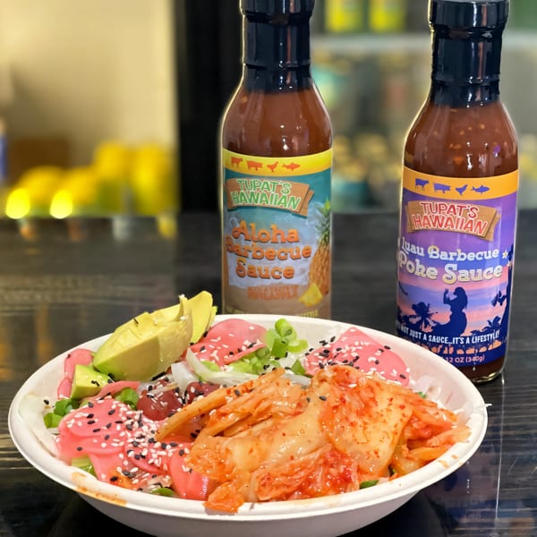 DaKine Hawaiian Kitchen NSB poke bowl with avocado, kimchi, and two Tupat's Hawaiian sauces.